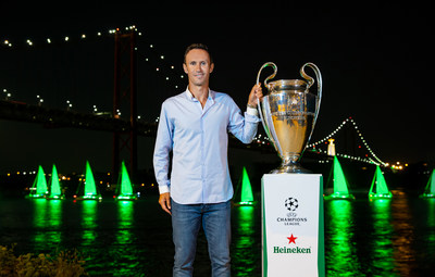 UEFA ambassador and former UEFA Champions League winner Ricardo Carvalho stands beside the trophy on the banks of the Rio Tejo, as Heineken® 'paints' Lisbon green to celebrate the tournament's return.