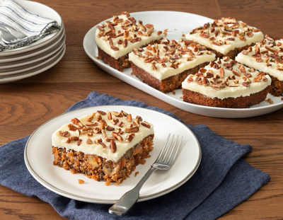 Carrot Cake includes a moist carrot cake baked with coconut, pineapple, walnuts, cinnamon and vanilla, then topped with a generous spread of cream cheese icing and chopped pecans.