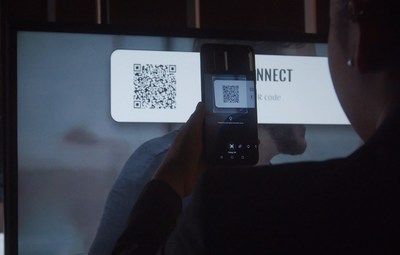 Guests scan the enseoCONNECT QR code with their smartphone to control connected guest room devices