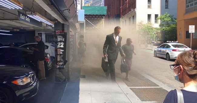 Augmented reality tech reveals people passing by a Beekman Street parking garage as they flee lower Manhattan through smoke and ash on September 11, 2001.