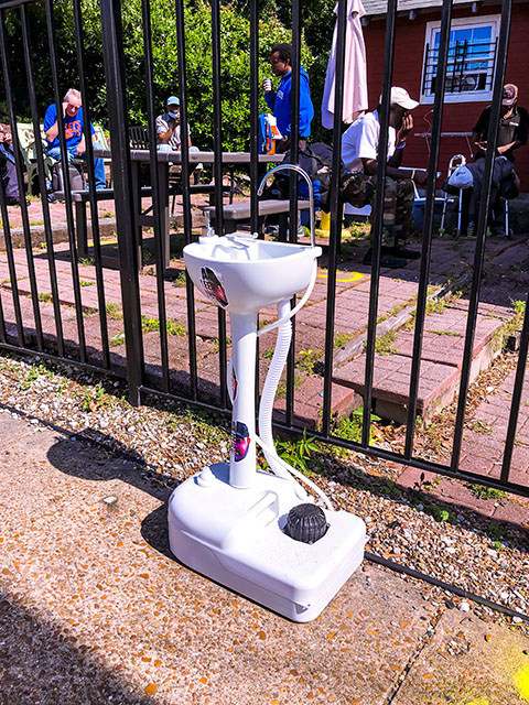 Portable Hand Washing Stations donated by nonprofit, A Lee Dog Story set up across the city of Memphis for people experiencing homelessness.