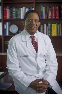 Close-up of Dr. Selwyn Vickers, MD (Dean, School of Medicine) in white medical coat, 2013.
