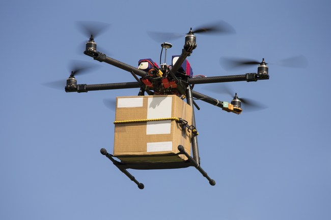 Up, up and away! Drone delivering packages.