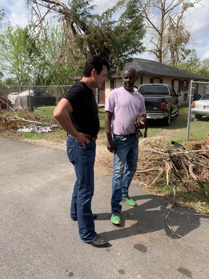 Schnatter speaks with a Lake Charles Resident during his tour of the community that was impacted by Hurricane Laura.