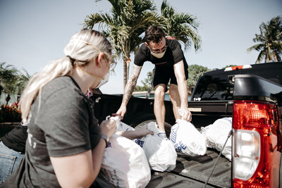 Convoy of Hope volunteers in Florida pack bags of groceries for distribution as part of their "100 Million Meals and Counting" initiative.