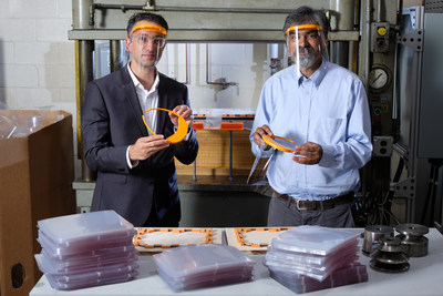 University of Tennessee (UT) Assistant Professor of Architecture Maged Guerguis, left, and IACMI Chief Technology Officer Uday Vaidya display the UT Shield in the IACMI-supported Fibers and Composites Manufacturing Facility on the UT campus in Knoxville.