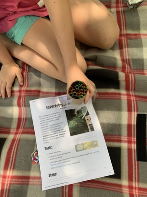 Subaru of America, in partnership with the American Association for the Advancement of Science (AAAS), creates science-based activities for families and online educational resources for educators. Child shows insect hotel created during the 