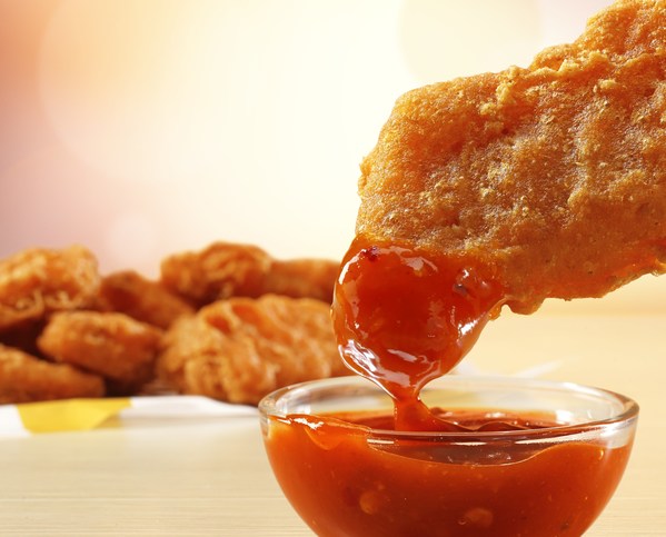 Spicy Chicken McNuggets dipped in Mighty Hot Sauce