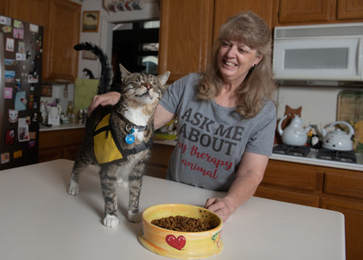 Purina Cat Chow is donating $30,000 to Pet Partners to encourage the training and registration of therapy cat teams like Tommy the blind cat and his owner Christy.
