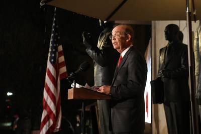 David Eisenhower stands beside a sculpture of his grandfather, Dwight D. Eisenhower, as he makes remarks at the dedication of the new memorial to the 34th President of the United States.