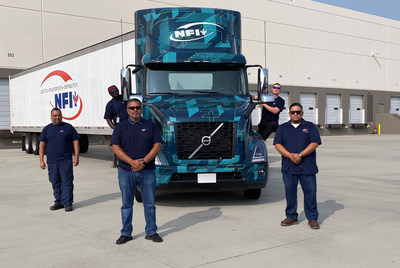The Volvo VNR Electric trucks will be based at an NFI facility in Southern California that serves as a central distribution center for the region. From left to right: Robert Estrella (driver), Chibuike Nwadigo (driver), Hector Banuelos (fleet manager), Jeffrey Howard (driver), and Elvis Alvarado (driver).