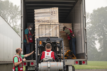 Sifters are loaded into a truck that will deliver them to families affected by the wildfires in Silverton, Oregon.  Sifters will be used to salvage items remaining at burned homes. (Photo by Scott Dalton/American Red Cross)
