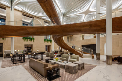 The centerpiece of the Waterline Club is Rockwell Group's dramatic three-level space that connects the club's 30 curated spaces with sculptural pedestrian bridges and a dramatic staircase that, in a nod to the development's waterfront location, was inspired by a boat's wooden hull and was crafted by Maine-based yacht builders, Hewes & Company and New York-based metal and glass fabrication firm, Jaroff Design.
