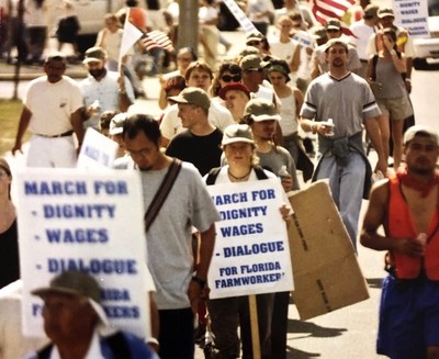 Steve Hitov (back and left, with cap) consulting with CIW Co-Founder Lucas Benitez during the March for Dignity, Dialogue, and a Fair Wage (2000)