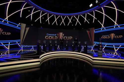 Photo of first-ever Gold Cup Draw's stage. Large television screens display the new Gold Cup branding.