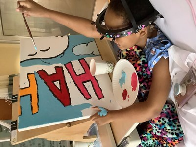 Flying High with Woodstock: Young patient Za’Nii Roundtree shows off her awesome painting skills as she contributes to a new Snoopy and Woodstock mural at Gillette Children’s in St. Paul, Minnesota—hometown of Peanuts creator Charles Schulz. The mural is one of 70 being donated to hospitals worldwide by Peanuts Worldwide and the nonprofit Foundation for Hospital Art as part of the global “Take Care With Peanuts” initiative, launched October 2in conjunction with the 70th Anniversary of Peanuts