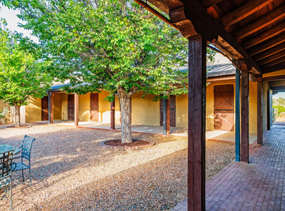 The equestrian center's 10 large horse stalls are solidly-built in the traditional adobe style, and surround a lovely courtyard that is frequented by singing birds. The stalls flank the equestrian center's living and entertaining quarters, which have been used as a film venue for the popular western series Longmire and also had a cameo in Johnny Depp's Lone Ranger film. Discover more at NewMexicoLuxuryAuction.com.