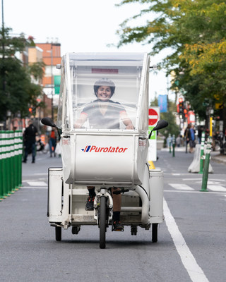 Purolator’s e-bike can use bike lanes to deliver packages in busy downtown core areas. (CNW Group/Purolator Inc.)