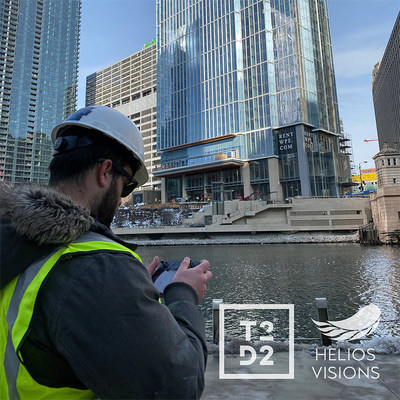 Tyler Gibson, Co-Founder of Helios Visions, conduting aerial drone inspection of high-rise building from downtown Chicago's Riverwalk. Helios Visions holds waivers and authorizations for a number of important drone operations including high altitidue, flying over people, operating at night, and within restricted airspace.