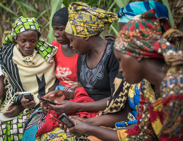 Women in Rwanda use mobile technology from DreamStart Labs to run an informal community bank. These digital savings groups help previously unbanked people to save money, build credit history, access loans, and achieve financial goals.