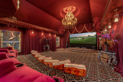 Shown here: the home theater. The vibrant colors and design were inspired by Russia’s Bolshoi Theater in Moscow. Learn more at OregonLuxuryAuction.com.