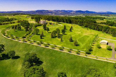 The 7,500-sf residence is perched atop a gently rolling hill, affording beautiful views of the surrounding hills and valleys. There are ample pastures for horse grazing, and a large barn on the property constructed in blue pine. Approx. 128 of the property’s 180 acres are suitable for vineyards. Learn more at OregonLuxuryAuction.com.