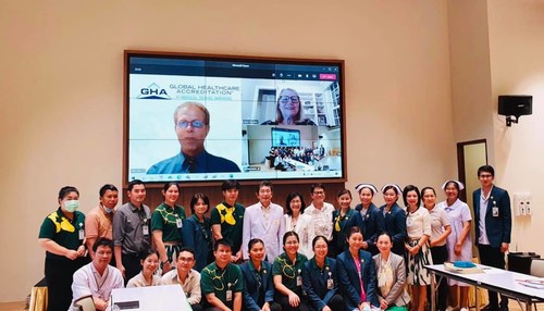 Ratchaphruek Hospital's CEO, Dr. Teerawat Srinakarin, along with staff and GHA's CEO, Ms. Karen Timmons and Bill Cook, Director of Business Development, as the latter announce their certification remotely.