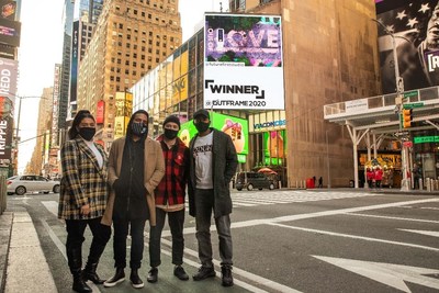 Future First Studio poses in Times Square with their winning creative "Selfless Love"