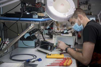 In the electronics laboratory, Adrián Hitos checks that the machines are working correctly for the last time