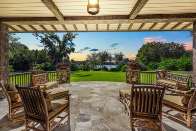 A large, covered terrace with stone flooring offers the perfect venue for enjoying a sweet tea or cold lemonade on warmer days, or for cozying up with a book and some blankets on Georgia’s cooler evenings. Peaceful views of the manicured landscape and Frederica Lake provide a lovely backdrop. Learn more at GeorgiaLuxuryAuction.com.