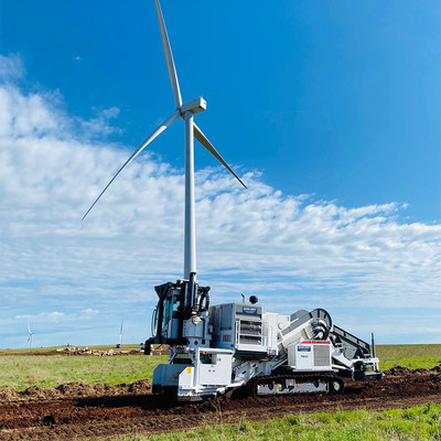 A Cross County SPD-250 EVO SCAIP Padding Machine working on a Wind Farm construction project.