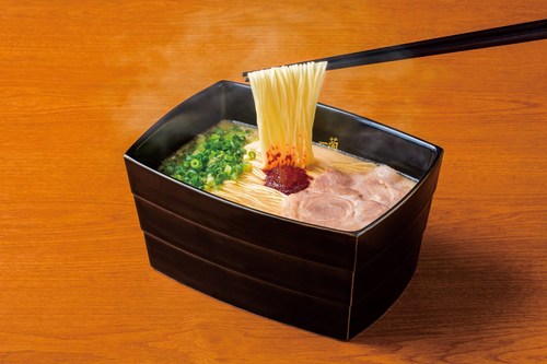 Authentic tonkotsu (pork bone broth) ramen served in bowls inspired by traditional multi-tiered Japanese lunchboxes.