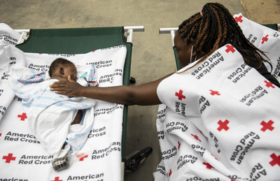Cassandra comforts her baby Chaya, 2 months old, at an American Red Cross shelter in Alexandria, Louisiana, on August 28, 2020. Cassandra and Chaya were among 85 people at the shelter who were also displaced from their homes by Hurricane Laura. Photo by Scott Dalton/American Red Cross