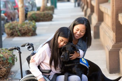 Ava and her mom Cynthia with Canine Companions assistance dog Hawaii