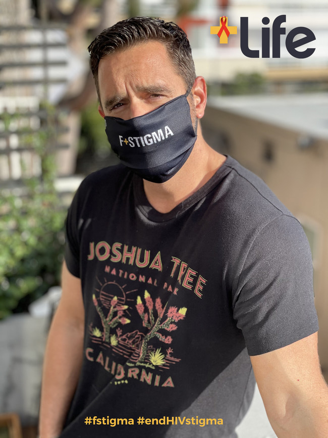 Karl Schmid, co-founder of +Life, wears the F+Stigma mask to fight HIV stigma in support of World AIDS Day (Dec. 1)