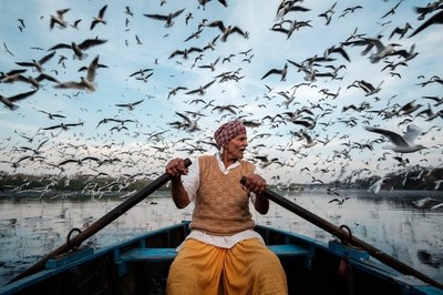 A Man Who Feeds the Migratory Birds by Saurabh Narang, Germany