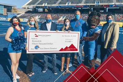 Jason Smith and Angie Phillips of Mountain America present the check to Bob Carney and Sara Swanson of Boise State Athletics at Boise State University.