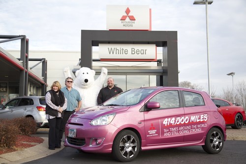 Janice and Jerry Huot pose with Richard Herod III, dealer principal, White Bear Mitsubishi, in front of their trusty 414,000-mile 2014 Mitsubishi Mirage.