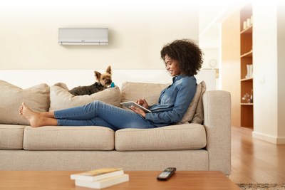 Woman Enjoying At-Home Comfort with Mitsubishi Electric Trane HVAC US Unit