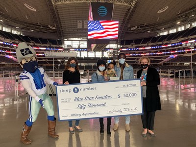Dallas Cowboys mascot Rowdy, Sleep Number, Blue Star Families, and Army National Guard Specialist Don Hogan and his family present a check for $50,000 to support sleep and wellness programs for military families.