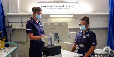 Two National Health Service workers pictured with the CyberMed NB22 medical computer preparing to deploy the COVID-19 vaccine in the United Kingdom's most ambitious immunization program in history.