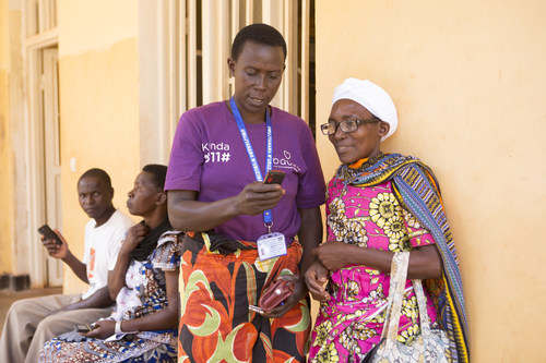 A Babyl support worker helping a patient in Rwanda