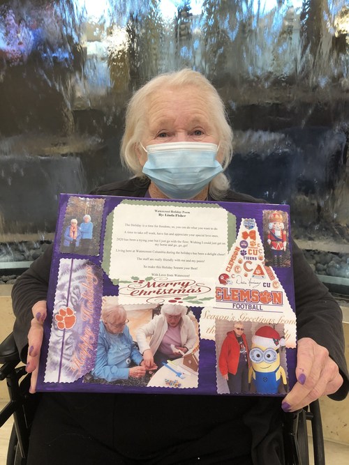 Residents at Watercrest Columbia Assisted Living and Memory Care are  sparking their creativity through Watercrest's signature programming, Artful Expressions.  Resident Linda Fisher proudly displays her 'Holidays Over the Years' canvas collage, showcasing her unique poetry and individual artwork created in a Watercrest creative writing workshop.