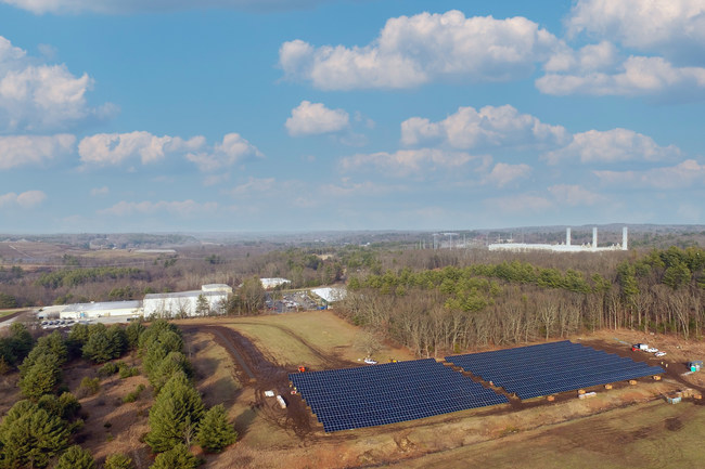 2,160 high efficiency panels sit erected adjacent to Miyoshi America, Inc.'s headquarters and manufacturing facility in Dayville, CT.
