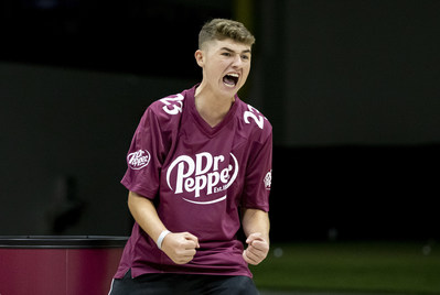 Tate Lewis celebrates winning $125,000 during the 2020 Dr Pepper Tuition Giveaway football throw competition on Monday, Nov. 16, 2020 in Frisco, Texas. (Brandon Wade/AP Images for Keurig Dr Pepper)