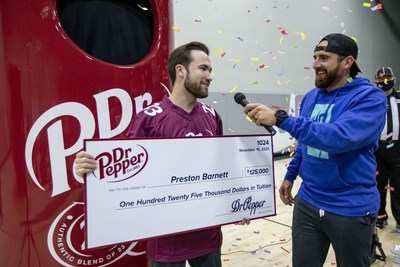 Preston Barnett, left, is interviewed by Dude Perfect member Tyler "Ty" Toney after competing in the 2020 Dr Pepper Tuition Giveaway football throw competition on Monday, Nov. 16, 2020 in Frisco, Texas. (Brandon Wade/AP Images for Keurig Dr Pepper)