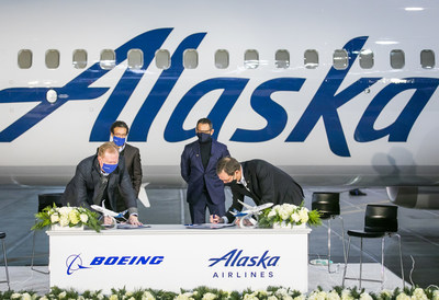 Executives from Alaska Airlines and Boeing sign the agreement. (From left to right: Stan Deal, Boeing Commercial Airplanes President and CEO; Ihssane Mounir, Boeing Vice President of Commercial Sales and Marketing; Ben Minicucci, Alaska Airlines President; and Brad Tilden, Alaska Air Group CEO.)