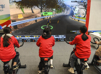 Visitors experiencing a cycling game