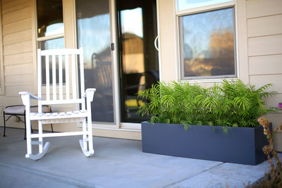 Grey low planter box as a desk accent