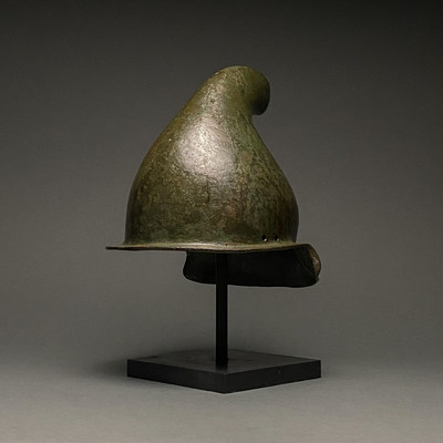 Rare Greek Hellenistic Phrygian bronze helmet, circa 500-300 BC, originally may have been associated with a statue of the god Attis. Provenance dates back to 1897 purchase by Jorg Krause. Fully authenticated with XRF Certificate from Belgian laboratory and 2020 European Export license. Estimate £30,000-£50,000